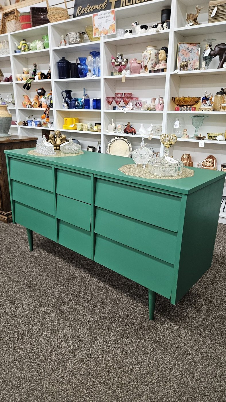 Green mid-century modern nine-drawer dresser refinished by Redeemed & Renewed